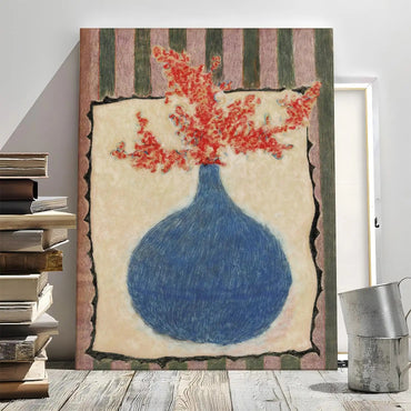Blue vase floral canvas wall art styled beside books in a modern room